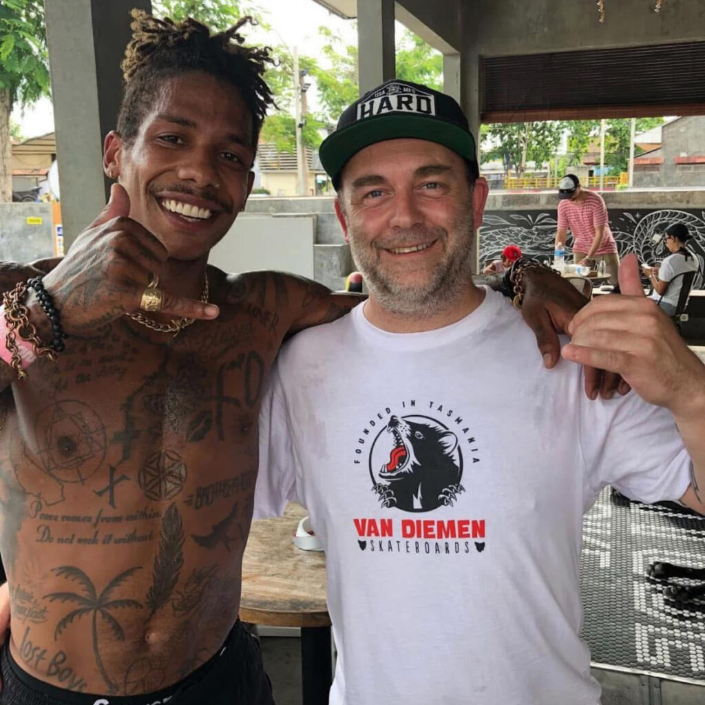 Paul McMacken wearing a Van Diemen Skateboards shirt at a skateboarding event